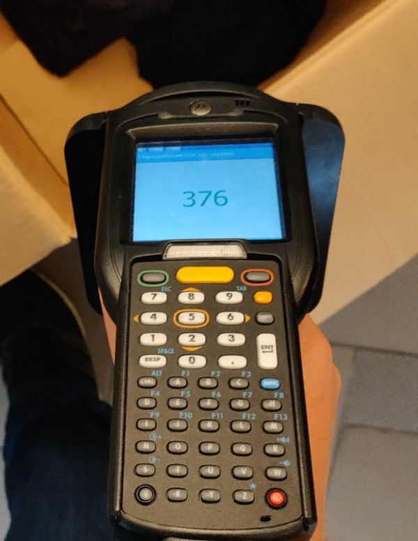 A handheld RFID reader is used in the warehouse for fast RFID tag reading, product search, pallet control, inventory, receiving, and shipping. The terminal can work together with barcodes, QR codes, and a WMS system.